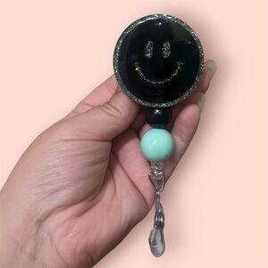 Black and Mint Smiley Faca badge reel